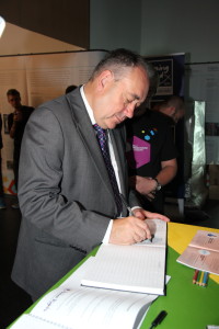 First Minister of Scotland Alex Salmond signing the visitors book